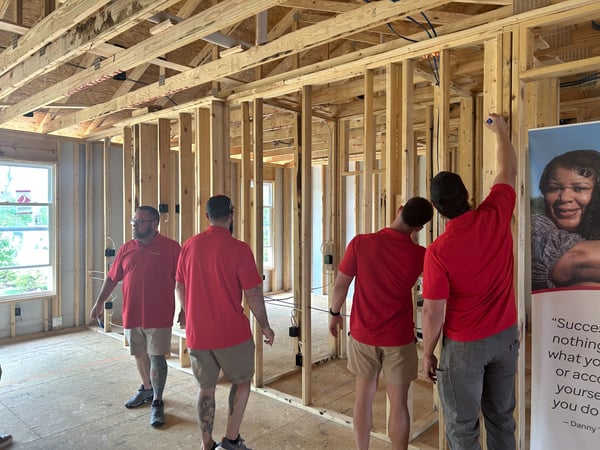 Fischer Homes associates and vendor partners standing inside the St. Jude Dream Home during construction.