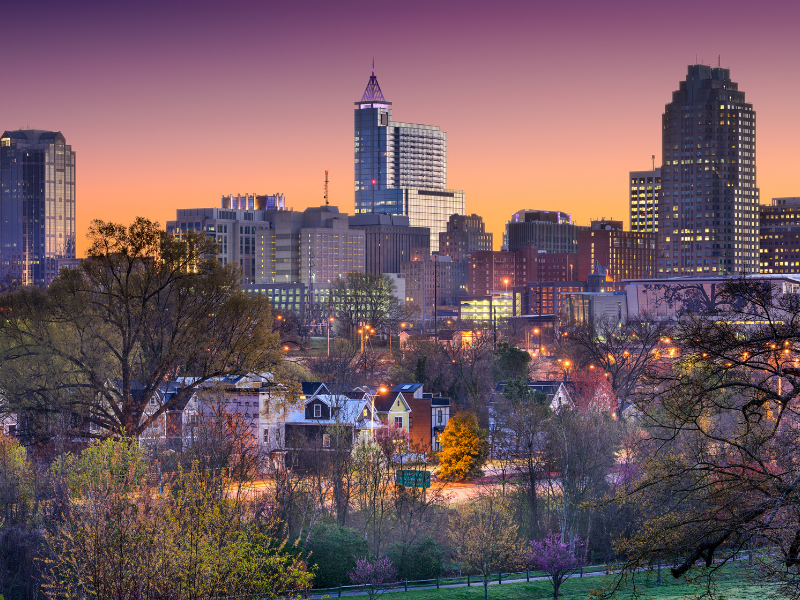 Raleigh North Carolina city view at dusk. Image provided by SeanPavonePhoto through Canva Pro license. Key Insight Raleigh’s neighborhoods stand out because they prioritize lifestyle-first design,