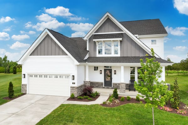 Charles model home at Streets of Caledonia by Fischer Homes, featuring a bright open-concept layout with a two-story family room, spacious kitchen, and first-floor owner’s suite.