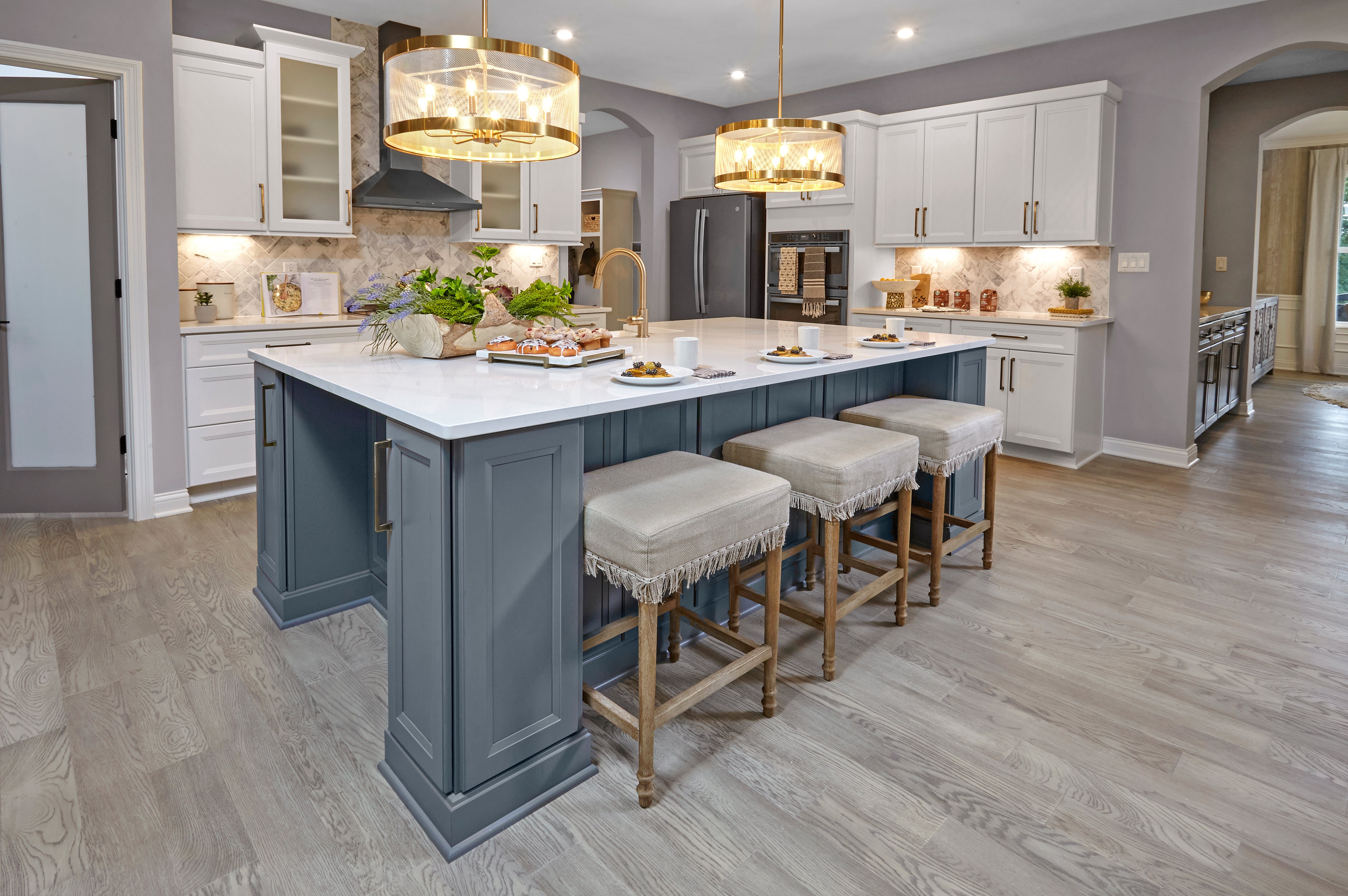 Leland Model Home at Chatham Brook at Chatham Hills large island kitchen with multi-height cabinetry